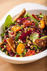 Tasty homemade vegan salad with granola grilled cheese and beet root. Organic food photography. For healthy living lifestyle. Food photography.