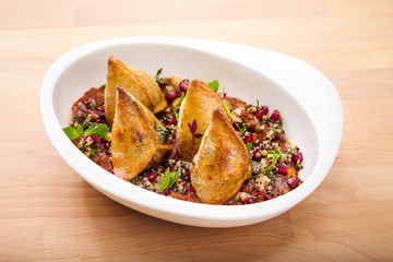 Delicious healthy salad with sambosa toppings. For healthy living. Perfect for takeaway and...