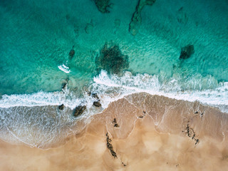 Aerial view of beautiful tropical beach and blue ocean landscape - heaven resort paradise concept for great sumer holiday vacation - tourism destination fuerteventura in spain canary islands