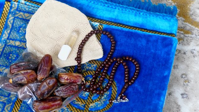 worship materials used by Muslims, prayer beads prayer rugs and fragrance,