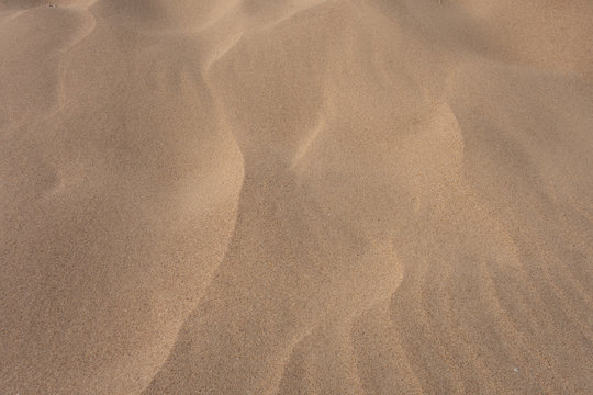 Sand dunes, waves of sand. Creative vintage background.