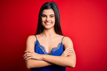 Naklejka premium Young beautiful brunette woman wearing elegant and comfortable lingerie underwear happy face smiling with crossed arms looking at the camera. Positive person.