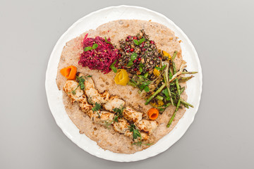 Grilled chicken tikka yoghurt with salad side dish. beetroot, asparagus, and quinoa. Perfect for healthy living vegetarian. Organic food photography concept.