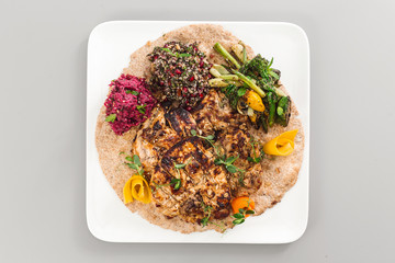 Grilled chicken yoghurt with salad side dish. beetroot, asparagus, and quinoa. Perfect for healthy living vegetarian. Organic food photography concept.