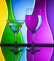 Wine glass with stunning background color patterns and reflections