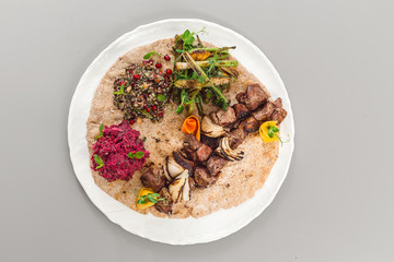 Delicious homemade beef yoghurt with salad side dish. beetroot, asparagus, and quinoa. Organic food photography concept top view.