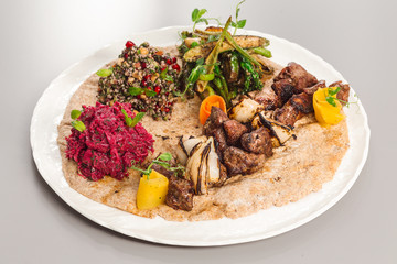 Delicious homemade beef yoghurt with salad side dish. beetroot, asparagus, and quinoa. Organic food photography.