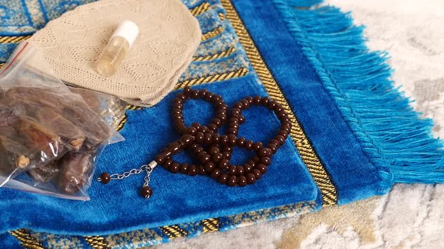 While muslims come from Hajj, they bring dates, prayer rugs and rosaries as a gift.