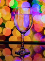 Wine glass reflection with colorful pattern and Bokeh reflection