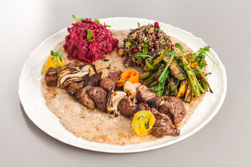 Delicious homemade beef yoghurt with salad side dish. beetroot, asparagus, and quinoa. Organic food photography focus view.