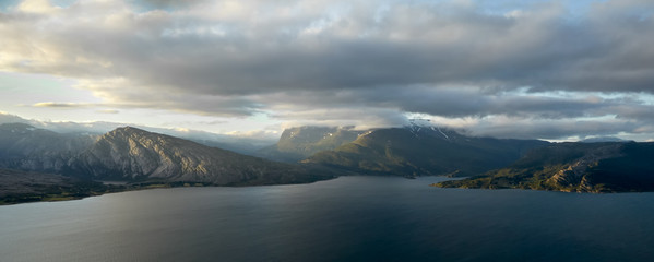 Panorama of the fjord. In the foreground, the water surface of the bay. 