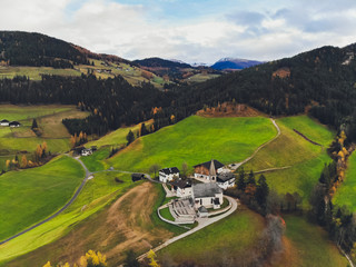 Sunset over the peaks of Puez Odle Nature Park in South Tyrol, Italy. the village of San Pietro.