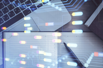 Multi exposure of data theme drawing hologram over topview work desk background with computer. Concept of technology.