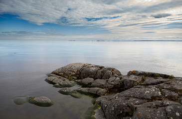 Landscape. Wildlife. Lake Ladoga. In the foreground is a rocky ledge of the island, going into the...