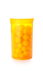 Bottle of pills on white background