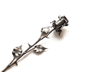 Cast-iron, hand-forged rose on a white background with a place for the inscription. Luxury, modern,...