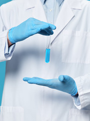 female scientist holding test tube