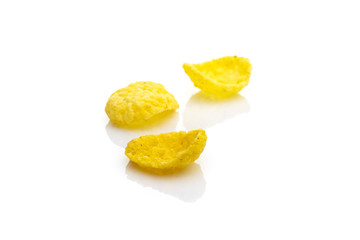 Isolated corn flakes on white. Snack Cereal yellow Healthy Cornflakes - Superfood background. Vegan gluten-free organic, healthy diet vegetarian superfood with antioxidant, mineral nutrients.
