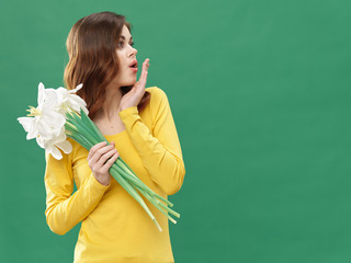 young woman in green dress with fan