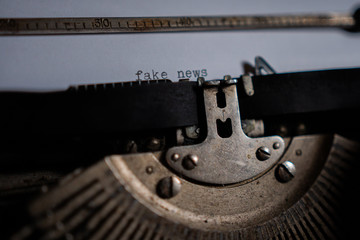 Typing "fake news" on retro typewriter