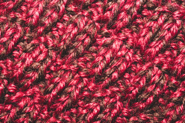 Knitted wool texture. fabric material macro. red textile background