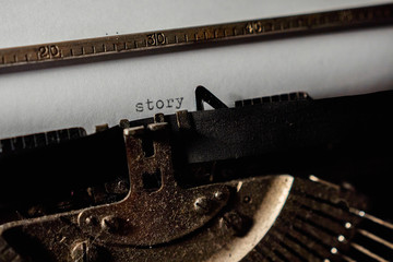Typing "story" on retro typewriter