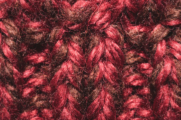 Knitted wool texture. fabric material macro. red textile background