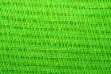 Green textile. knitted fabric texture. woven material close up