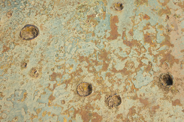 Old military relief texture of the tank green color. The marks of bullets and shrapnel on Board the armoured military vehicle