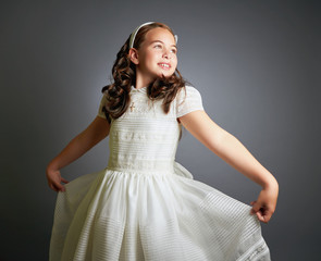 Gorgeous young girl dressed in white