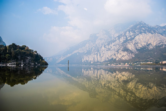 Beautiful reflection in Lake Como, near the town of Lecco in Lombardy, Northern Italy. Landscape, scenic picture.