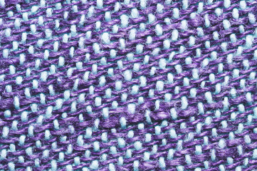 Fabric macro texture. knitted material. woven background. woolen textile close up
