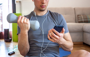 man on quarantine working and exercising at home