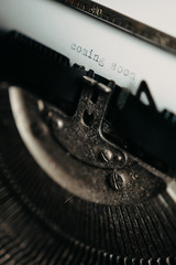Typing "coming soon" on typewriter