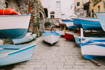 Fototapeta na wymiar wooden boats parking harbour in Cinque Terre