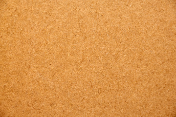 Fototapeta na wymiar Orange pressed texture of the background surface. Top view of a table surface with a wood texture.