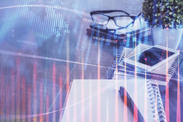 Double exposure of forex chart drawing and cell phone background. Concept of financial trading