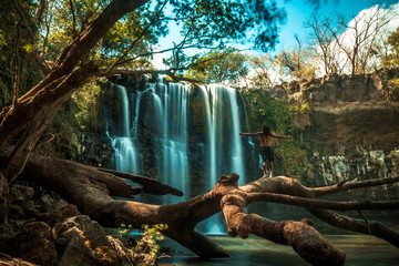 Person in a waterfall in the jungle