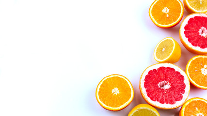 citrus mix on a white background with place for text, vitamin fruit set, healthy organic food. Juicy ripe orange, lemon and grapefruit whole and sliced
