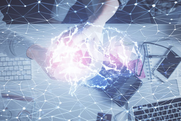 Double exposure of man and woman working together and human brain hologram drawing. Brainstorm concept. Computer background. Top View.