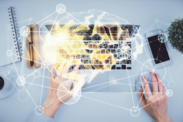 Double exposure of woman working on computer andhuman brain hologram drawing. Top View. Ai concept.