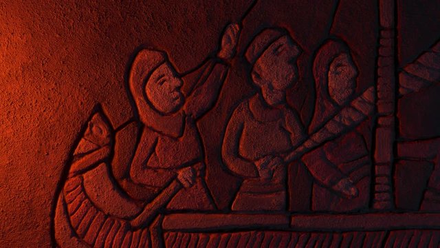 Men Steering Boat Stone Carving In Firelight