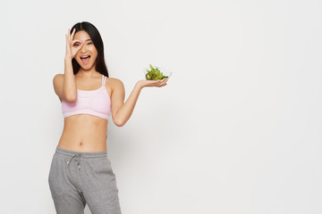 young woman holding a salad