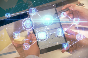 Double exposure of man's hands holding and using a phone and social network theme drawing.