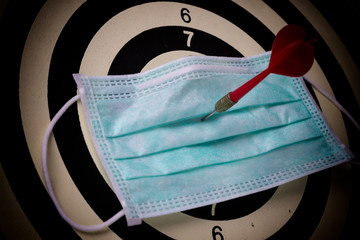 Red dart embroidered on health mask, Concept of WE WILL WIN on coronavirus,covid-19 outbreak around the world.