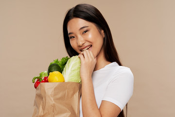 young woman holding shopping bag