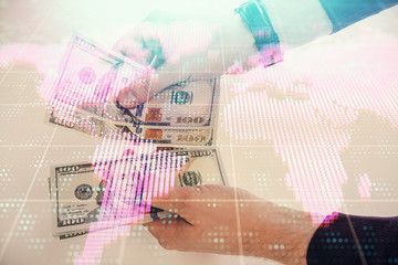 Multi exposure of financial theme drawing hologram and USA dollars bills and man hands. Business concept.