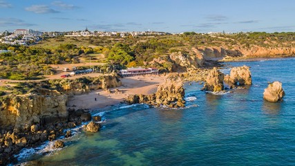 Aerial view of Arrifes beach, in Albufeira. Beautiful beach between the cliffs of the Algarve in...