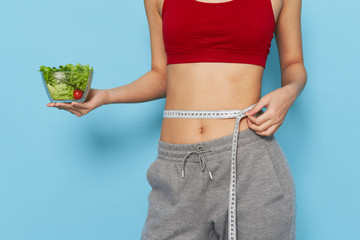 young woman with measure tape