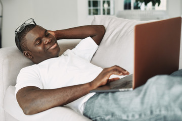 young man relaxing on sofa